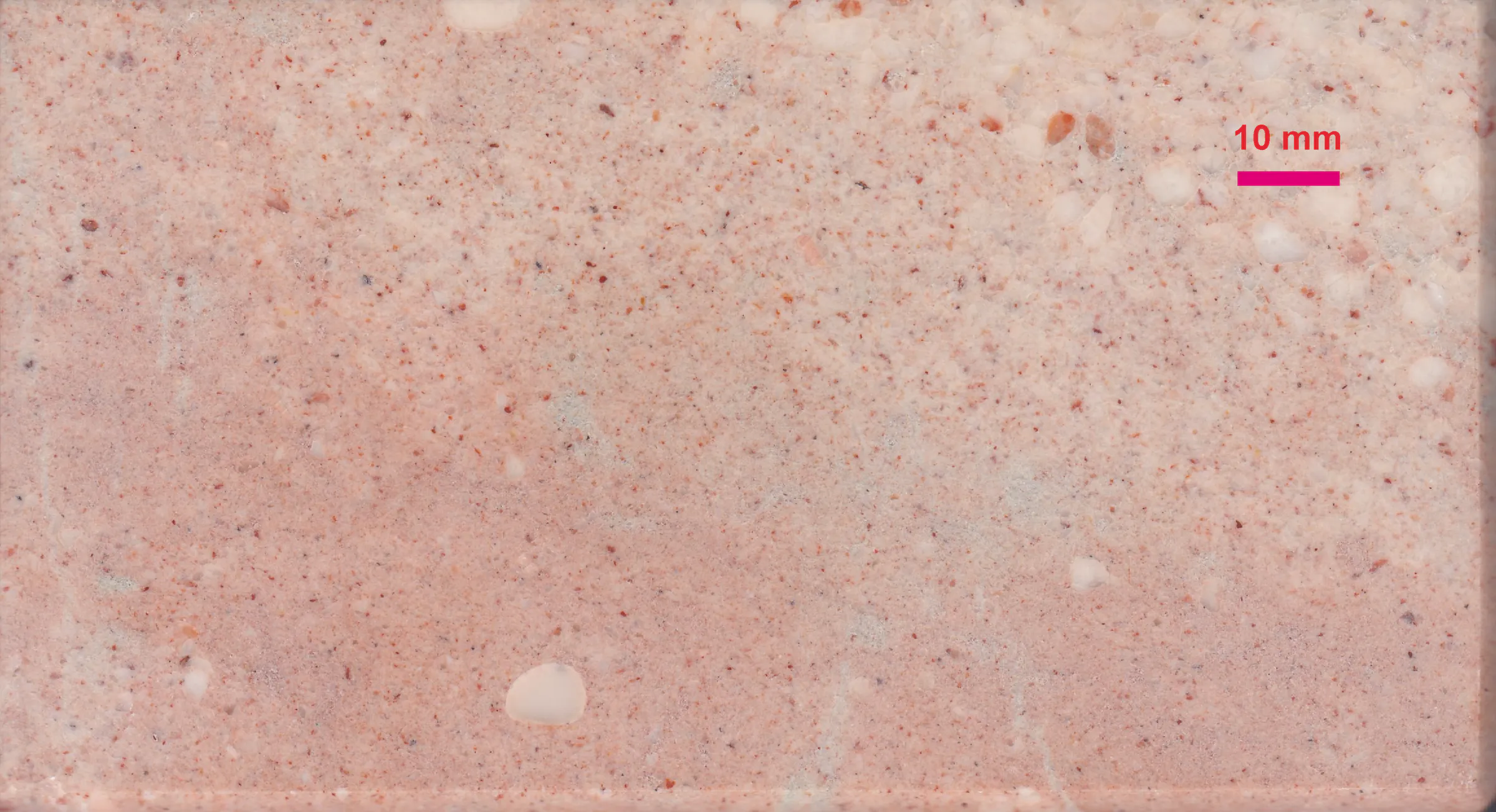 Macro material-reference photograph of Cretaceous Untersberg limestone, commercially called Untersberg Marble, with a 10 mm scale bar.