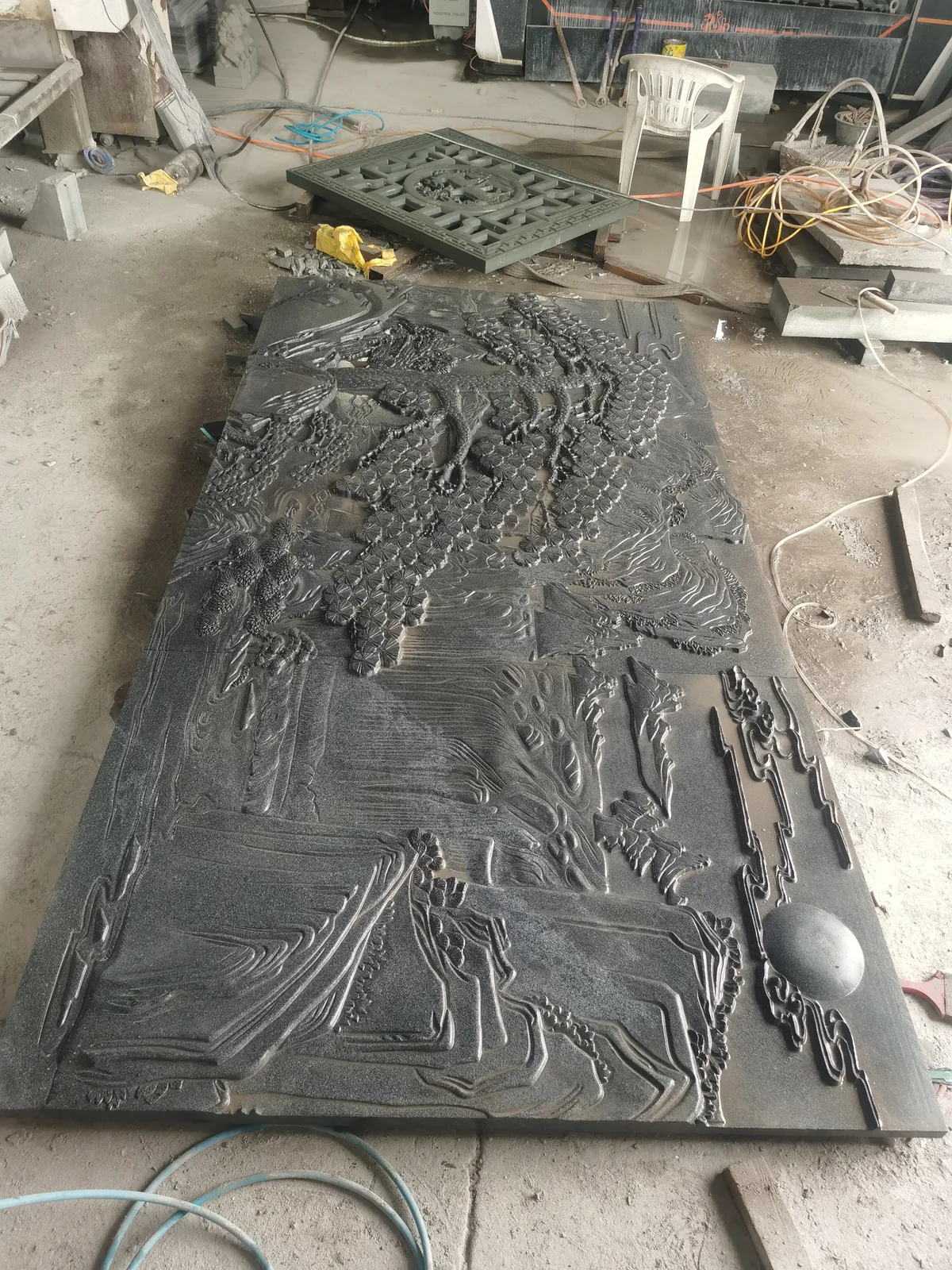 Detailed stone landscape relief panel.